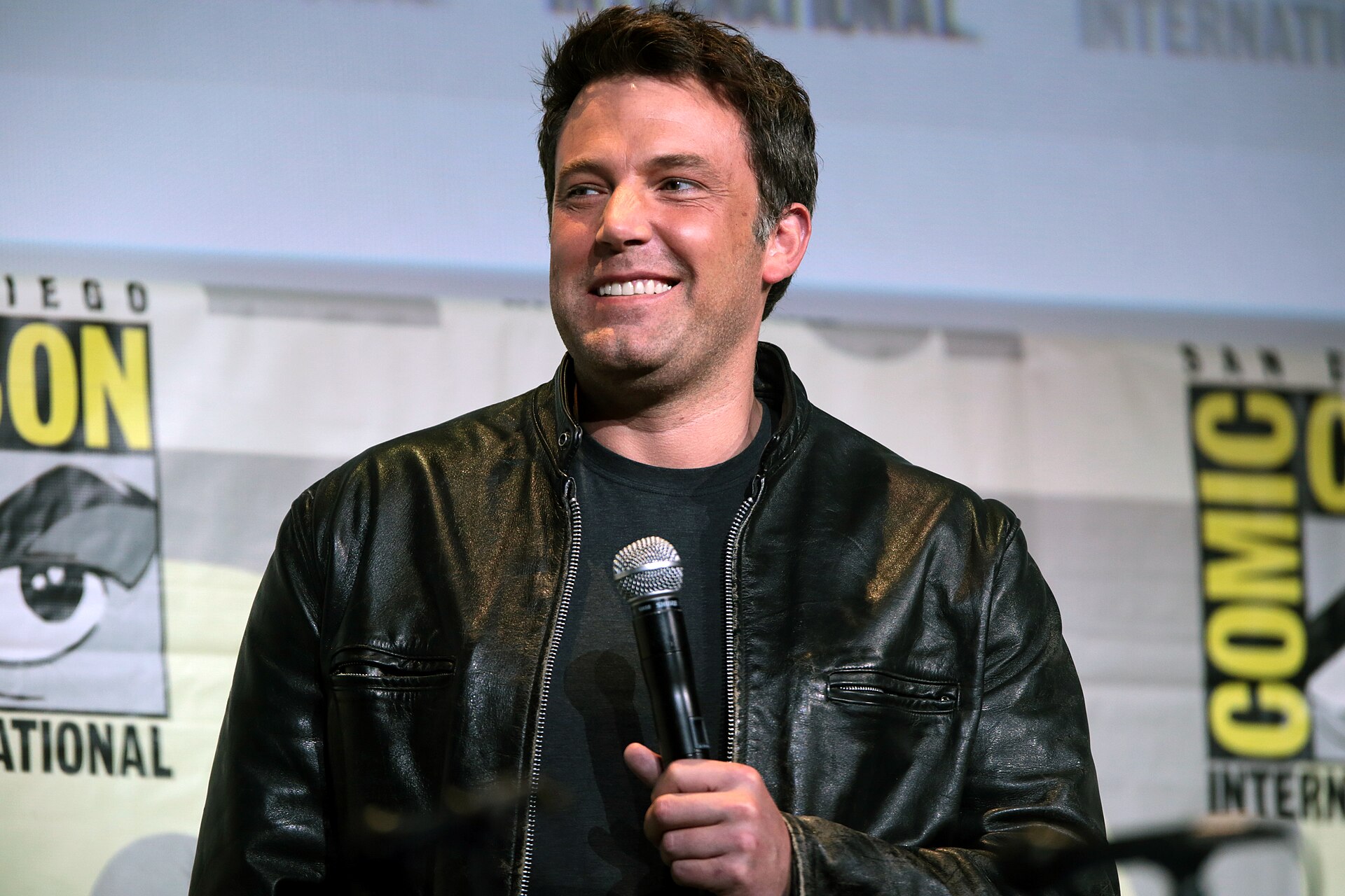 Ben Affleck speaking at a convention panel in 2016