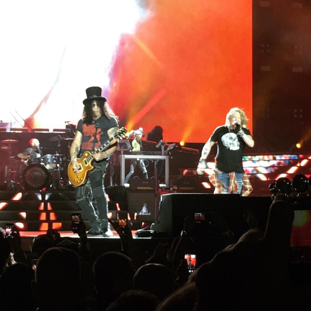 Axl Rose and Slash performing together on stage in July 2016
