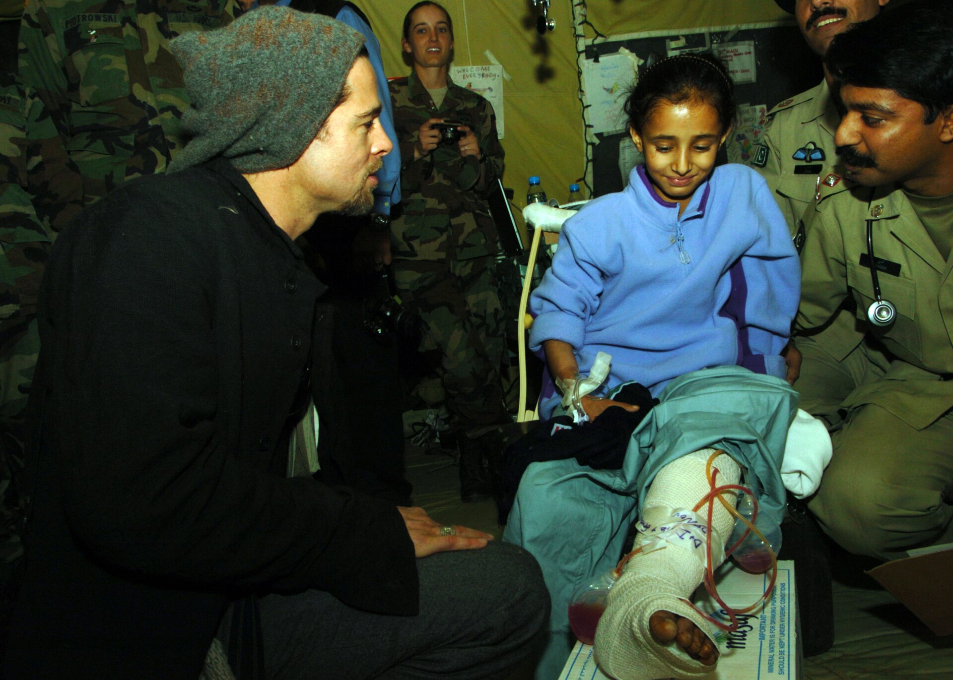 Brad Pitt visiting a patient at a field hospital in Muzaffarabad, Pakistan, in November 2005