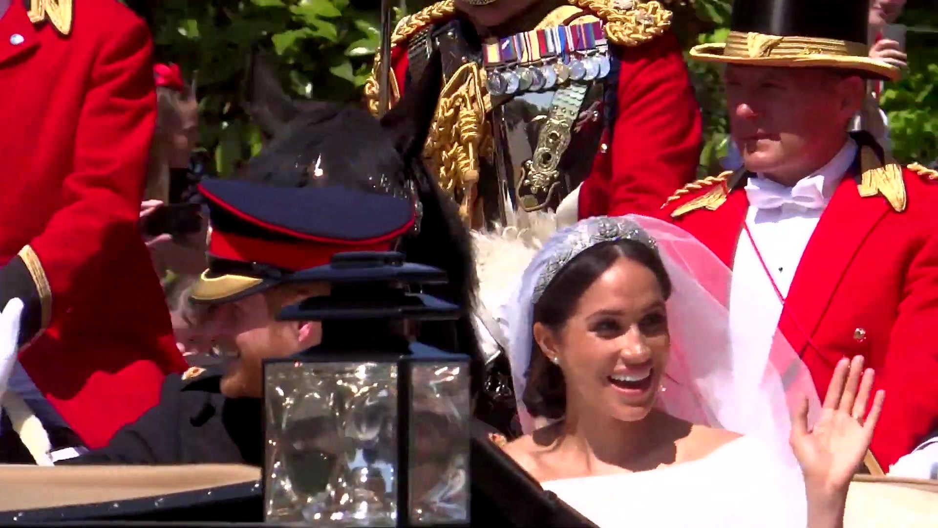 The carriage procession carrying the Duke and Duchess of Sussex through the streets of Windsor after their wedding