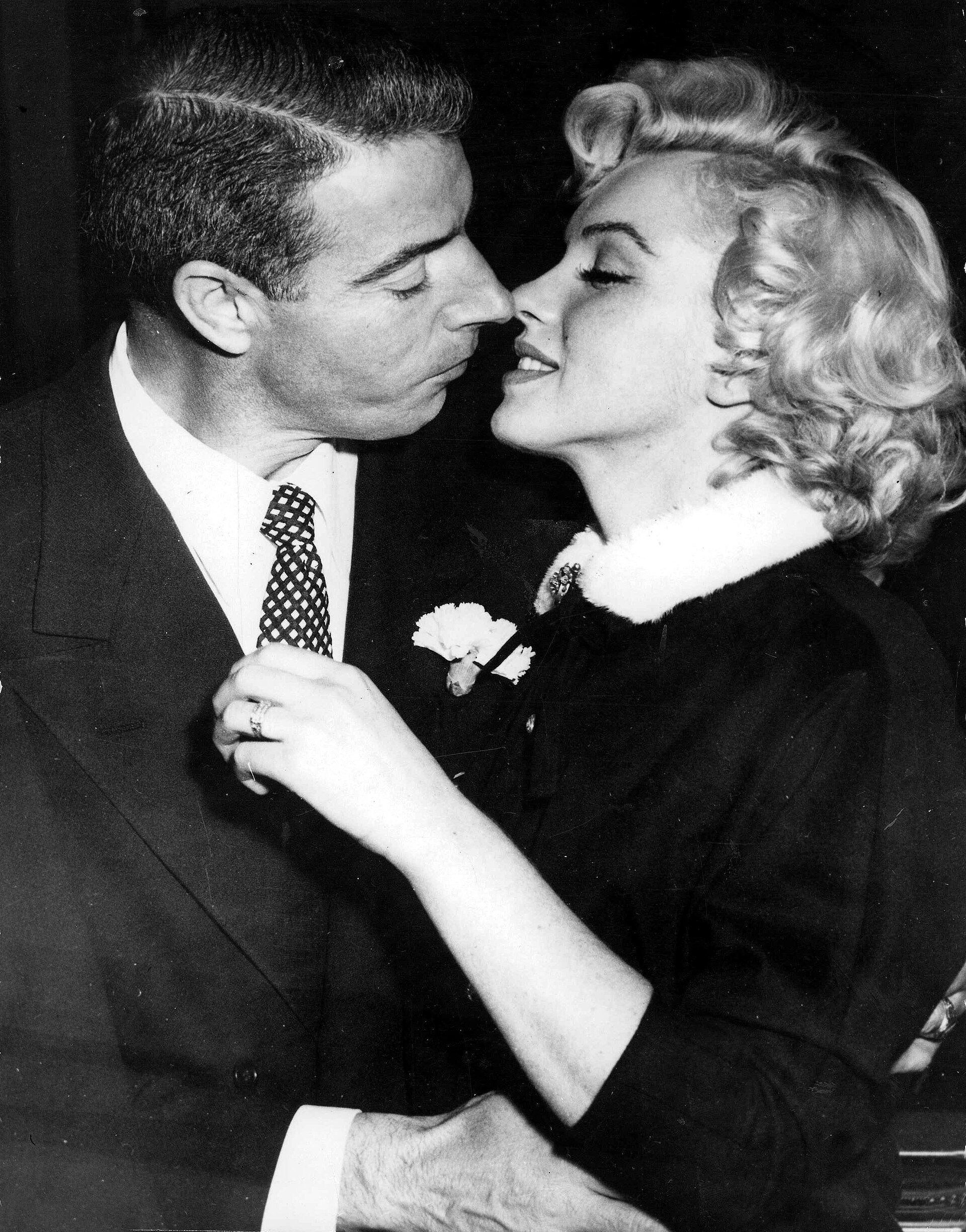 Marilyn Monroe and Joe DiMaggio on their wedding day in January 1954
